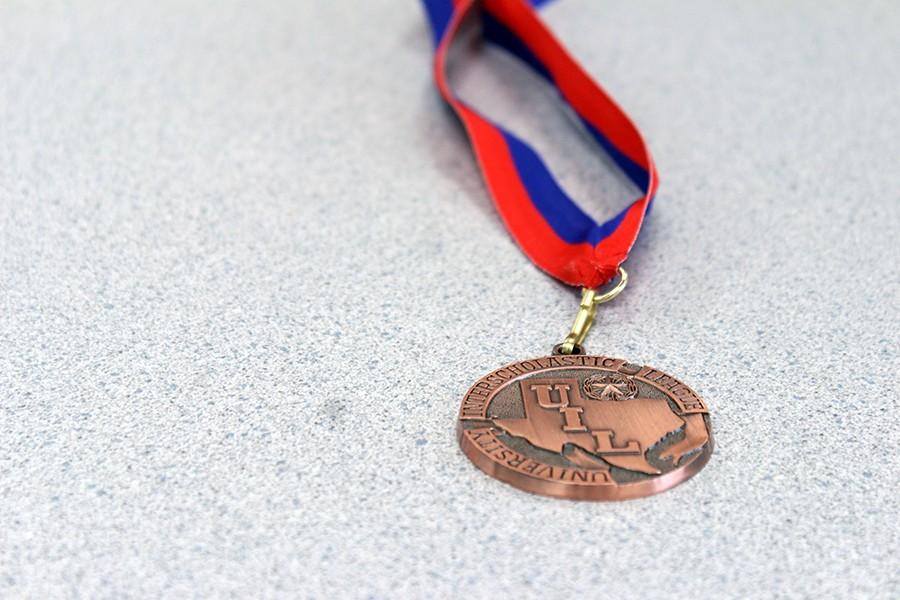 Senior Jack Densmores third place medal from Hays. Senior Natalie Ditsler placed fifth in News Writing.