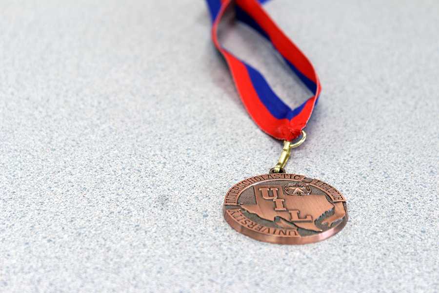 Senior Jack Densmore's third place medal from Hays. Senior Natalie Ditsler placed fifth in News Writing.