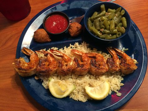 The above entree is the grilled shrimp which is $12.99. It comes with hush puppies, rice, green beans and cocktail sauce.