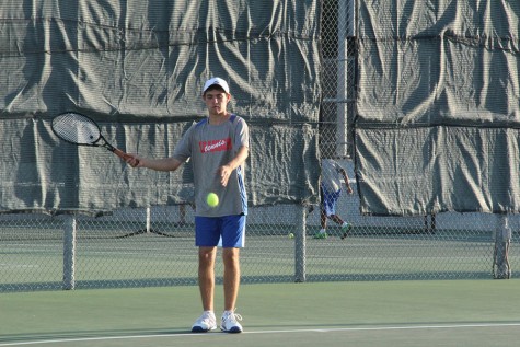 Senior Luis Farias getting ready to serve. He was with senior Joseph Rexroad and made it to the finals.