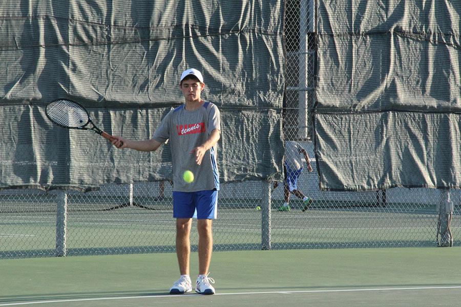 Senior Luis Farias getting ready to serve. He was with senior Joseph Rexroad and made it to the finals.