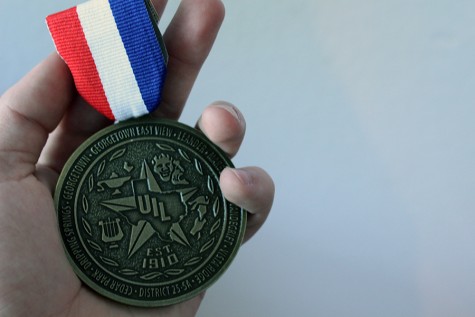 A first place medal won for first place in Editorial Writing. Thousands of UIL medals are received every year during the UIL season.