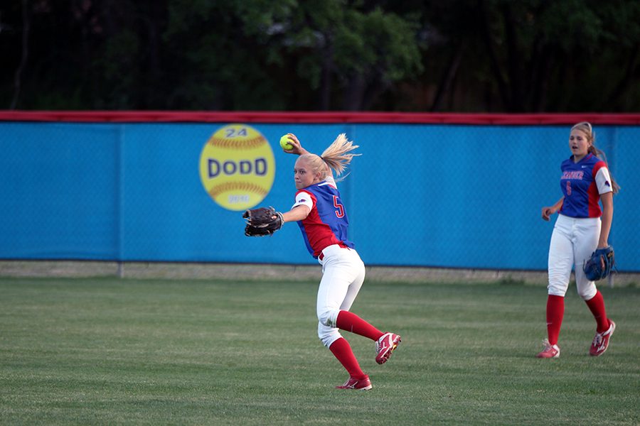 Senior Gabby Walton throwing from outfield against Cedar Park. Walton is one of the five seniors on the team.