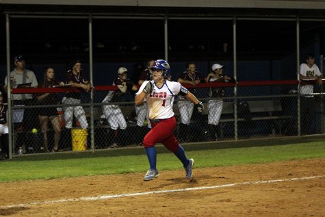 Freshman Haley Henderson running to home plate. Henderson also had a series of steals during the game.