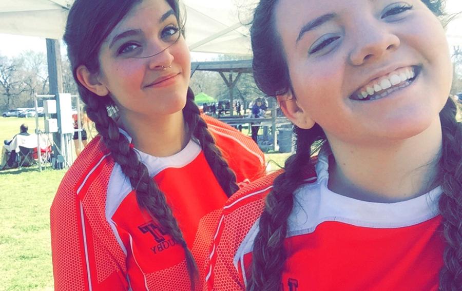 Senior Adrienne Peterson (left) with her rugby teammate. Peterson has played in six games of rugby.