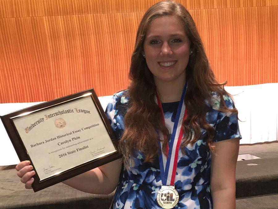 Carolyn Plein with her plaque and medal from winning first place at state for her essay. She also qualified for a scholarship. 