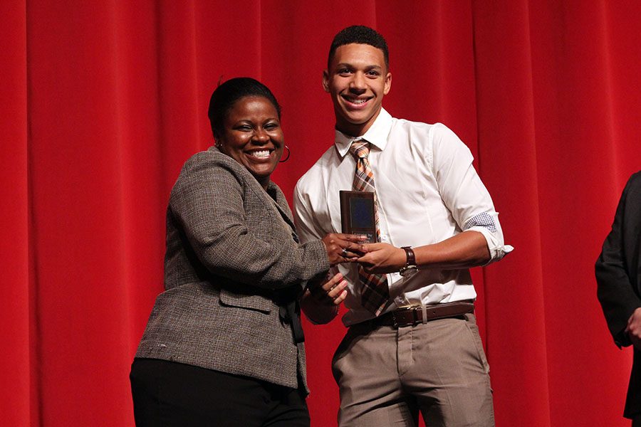 Doctor Spicer at the Senior Awards Ceremony posing with the Outstanding Boy of the year, Isaiah Turner.  She has been present at every school function she can possibly be at, in support of her students and faculty.