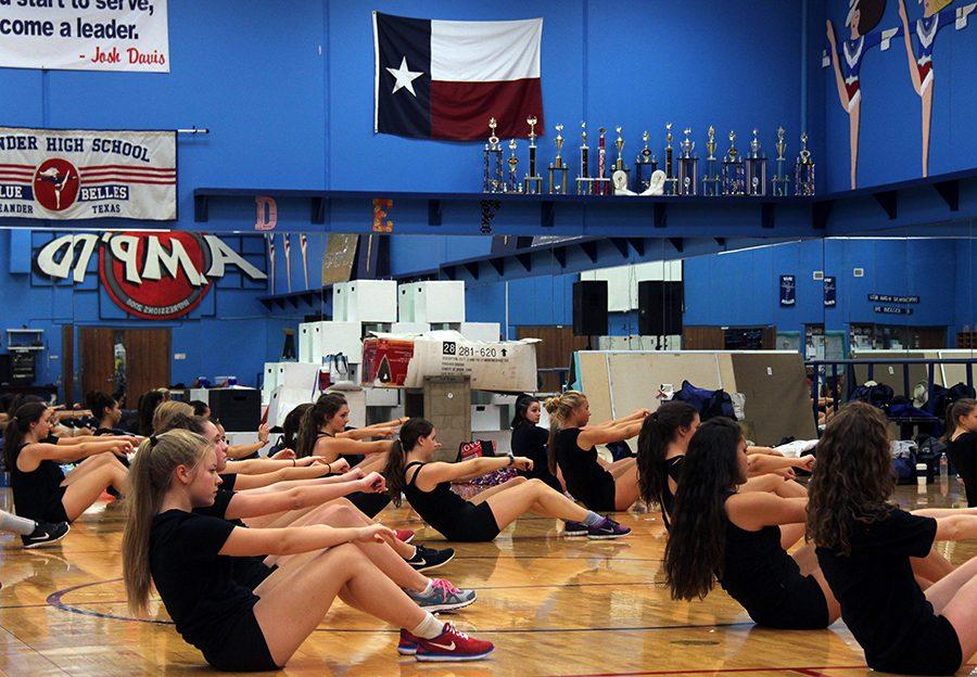 The Blue Belles doing different exercises and stretches during their camp ‘Metamorphosis’. Their workouts are called ‘go hard’ workouts.