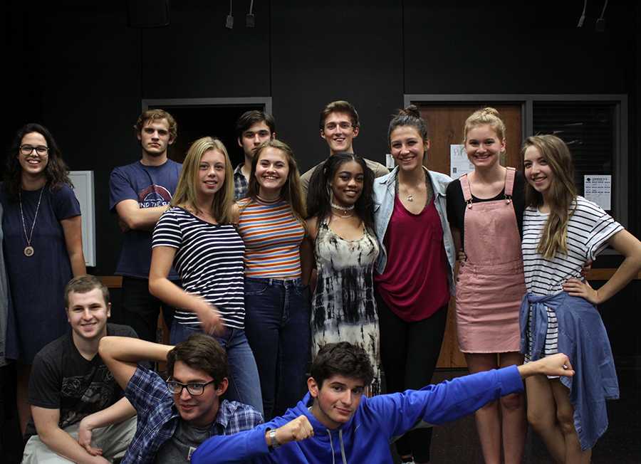 The cast of Big Love poses in the theatre room following the first rehersal. The cast will rehearse nearly every week until the show is performed on Mondays, Tuesdays, and Thursdays.