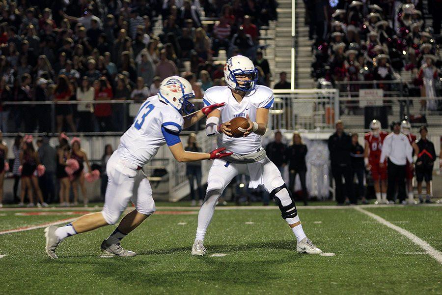 Junior Coltin Mitchell hands the ball of to junior Colt Davis. Davis rushed for 30 total yards.