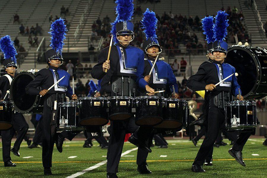 The Band performs during the Vista Ridge football game. Their show is called The Fourth Dimension.