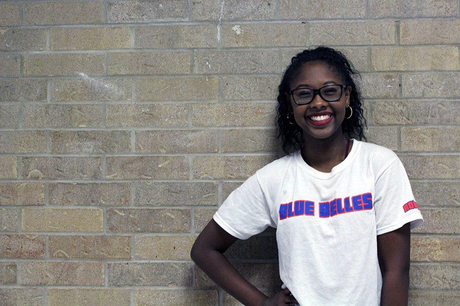 Sophomore Ayanna Zachary displaying her Blue Belle shirt. While she likes all styles of dance, her favorite style is hip hop.