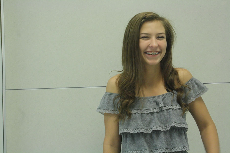 Sophomore Bella Cash is a flier on the Lions Cheer Squad. This means she is thrown in the air, and performs various stunts.