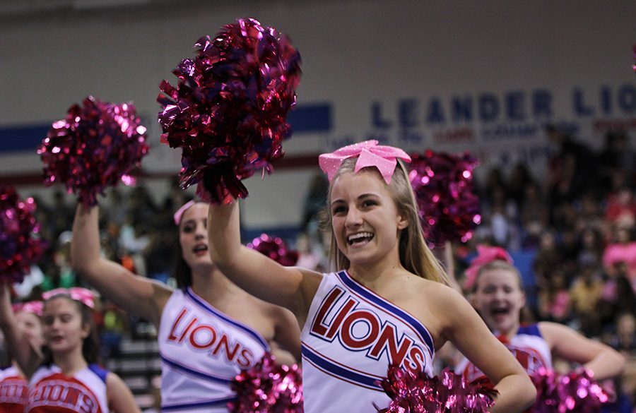 During+the+pep+rally+to+support+breast+cancer+awareness+the+cheerleaders+wore+pink.+There+was+also+a+dance+by+the+Blue+Belles+dedicated+to+women+with+breast+cancer.+