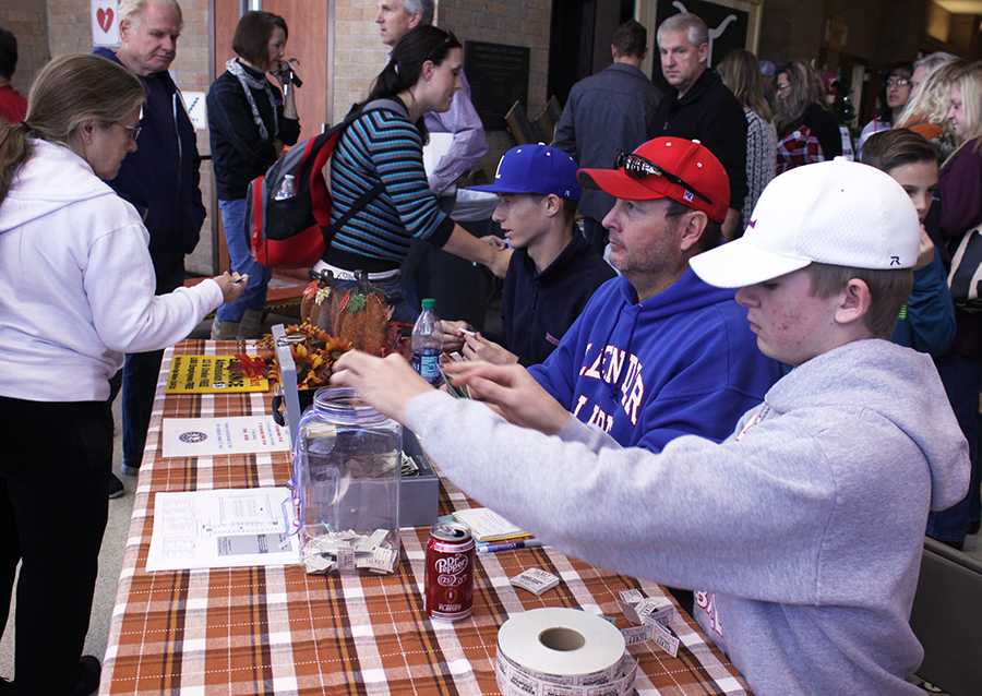 Sophomore Hudson Ruen and junior Bryce Trinkle ran the ticket booth at the Craft Fair. Tickets cost $3, and the money went towards the team.