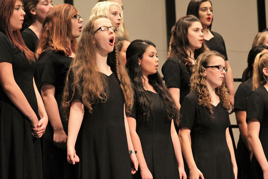 Women's choir singing at the annual holiday concert. This is the third concert Mr. Wiley has hosted.