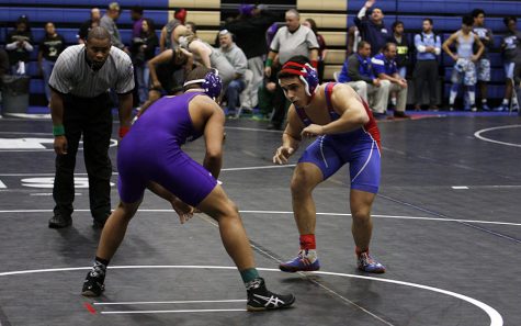 Senior Isaiah Wood wrestles during the Centex Invitational Tournament. The Lions placed 21 out of 43 teams.