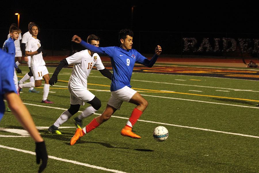 Senior Arturo Palomino looks to take the ball past a Rouse player. Junior Eduardo Escobedo was the only goalscorer for the Lions.