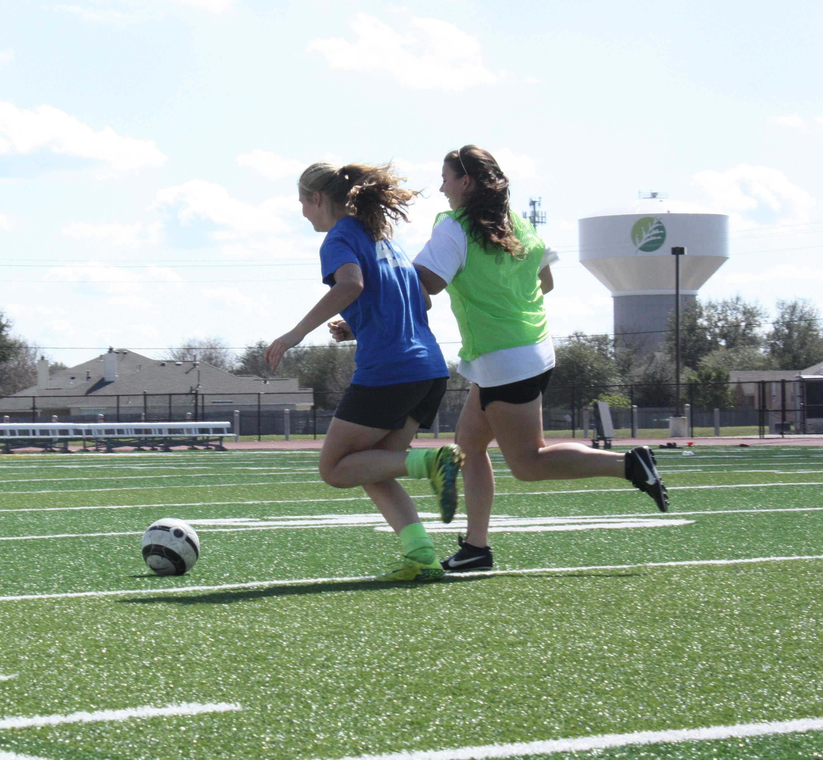 The girls practicing passing to each other during practice. The girls have played four games so far this season.