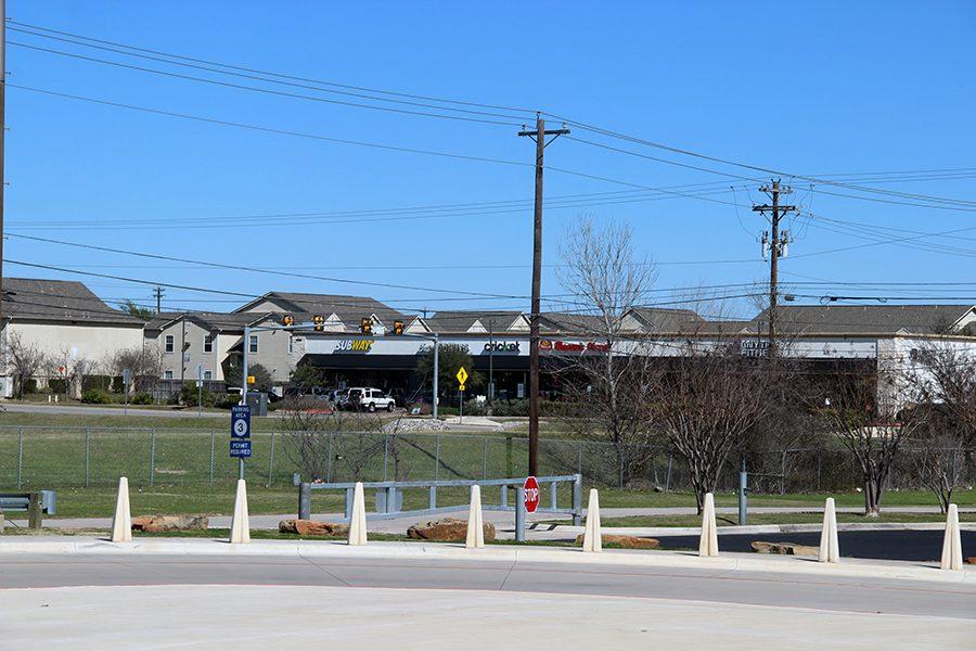 Students are able to see multiple restaurants that are open during lunch periods from campus. The shopping complex is across a busy street.