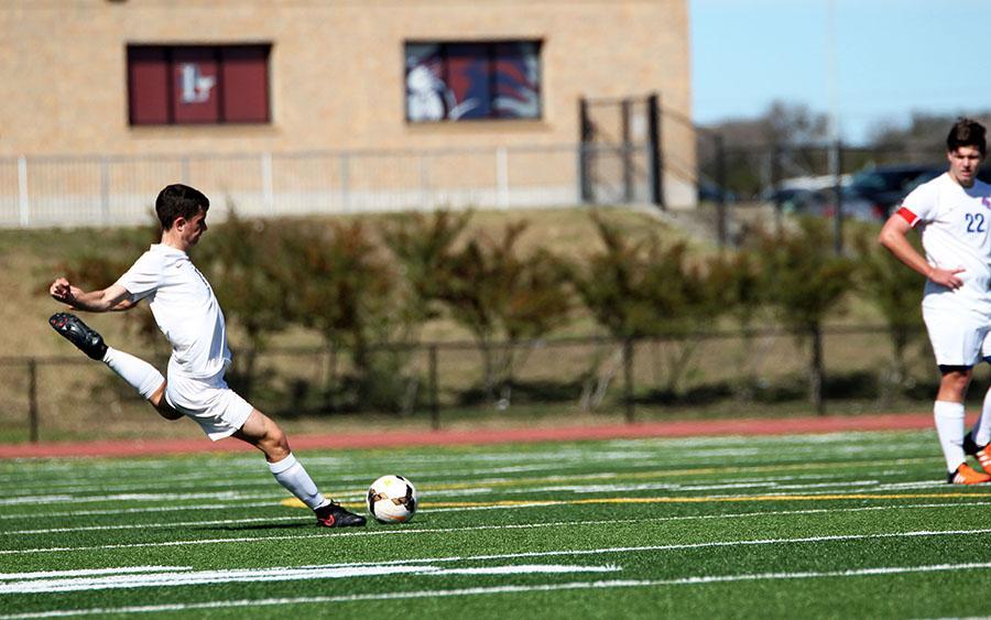 Junior Kyle Vogel takes a free kick against Marble Falls. This Friday will be their last game of the season.