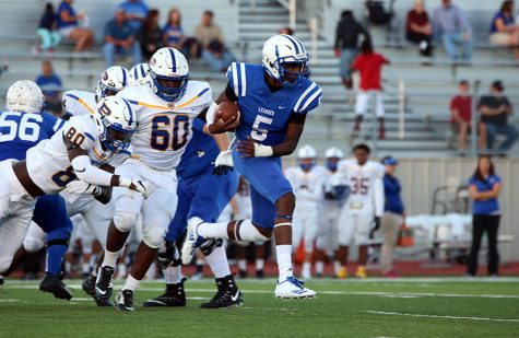 Junior Rashad Carter runs past the Pflugerville defense. He was replaced in the second half by sophomore Will Loofe. 