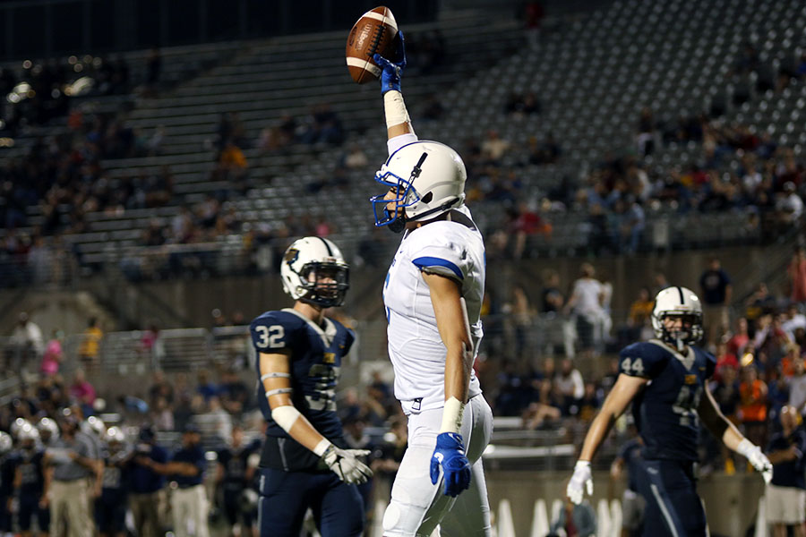 Senior Dalton Flowers celebrates his touchdown. This is his 4th of the year. 