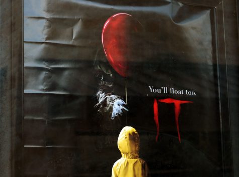 IT is a horror movie that follows the adventure of a group of kids trying to discover the reason for disappearances in their town. The villain is a clown called Pennywise. 