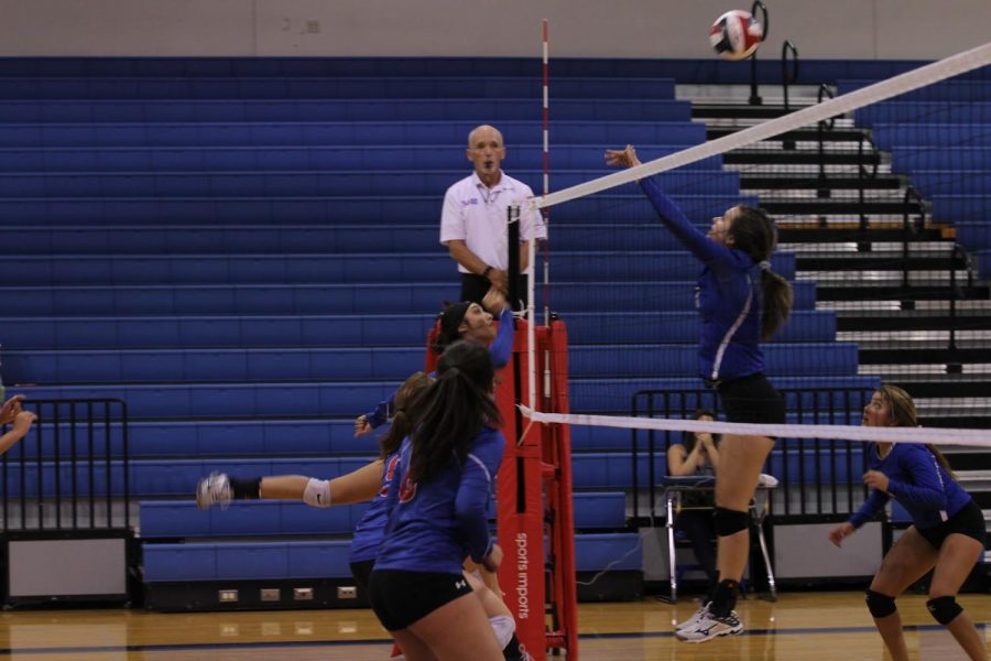 The+varsity+girls+jump++to+make+a+block+against+Westlake.+They+have+two+games+left+until+District.
