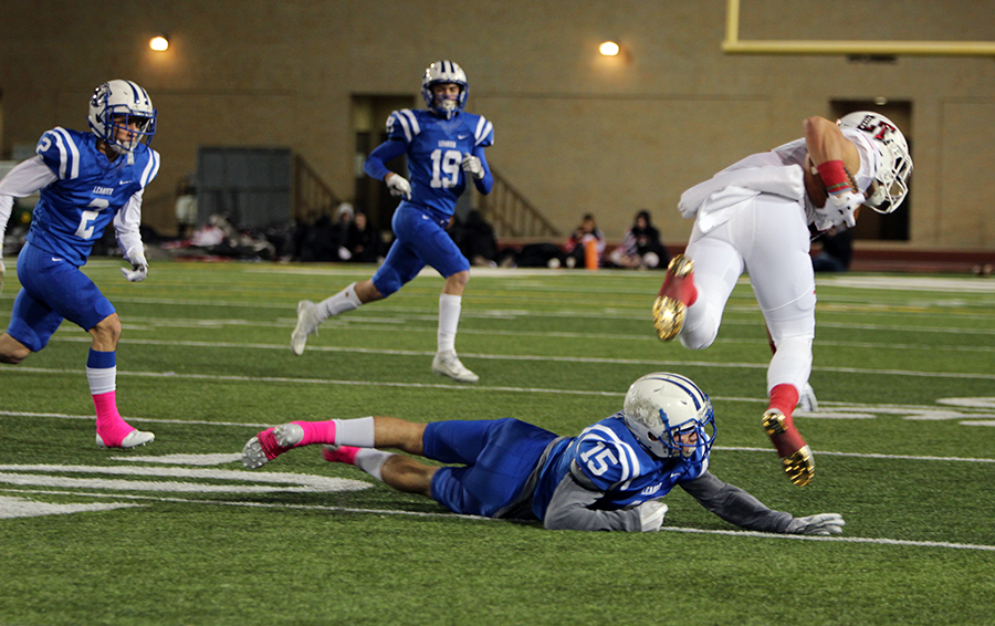 Senior Chase Barrick trips up a Lake Travis receiver. The Lions would fail to score in the game for the second consecutive game.