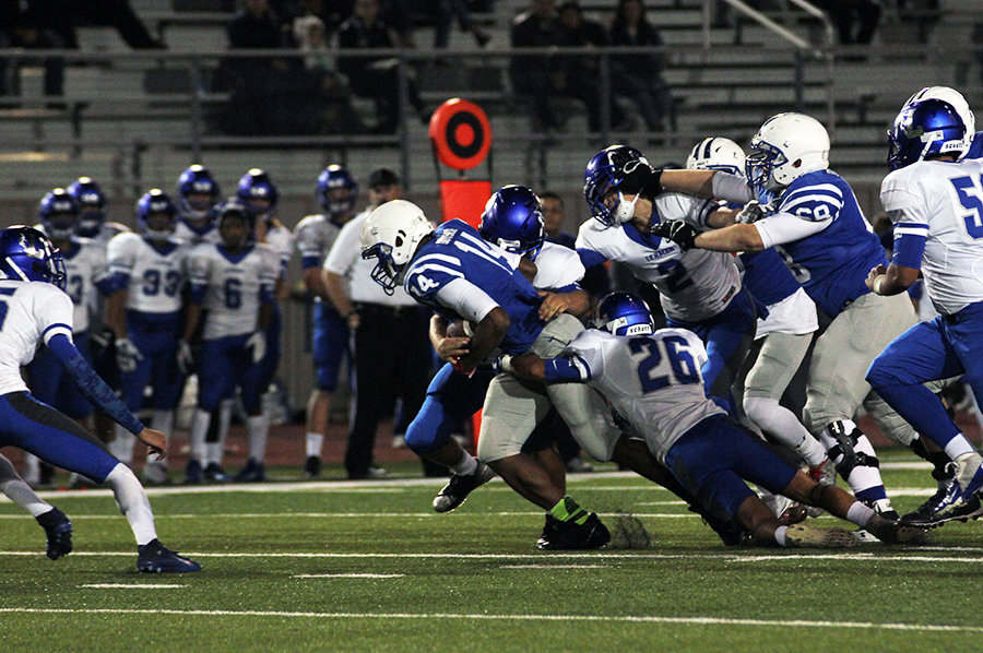 Sophomore Xavier Dotson charges ahead against the Lobo defense. He would score the second touchdown of the game.