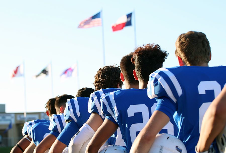 One of the biggest stories that had an effect on a vast amount of people was the debate over NFL players protesting the national anthem at their games. Here the varsity football players stand for the national anthem before their game against Pflugerville. 