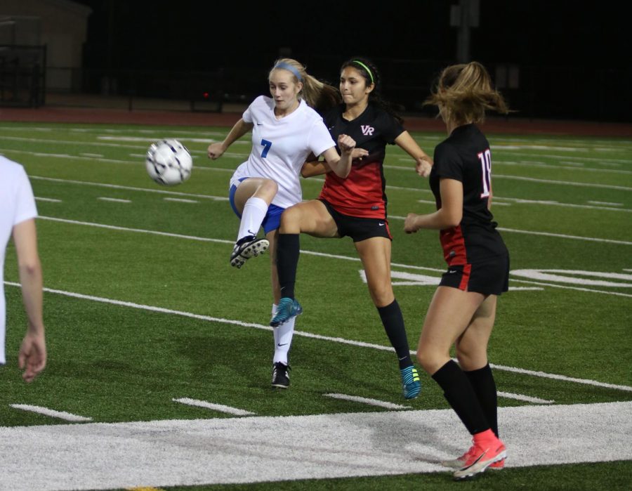 Junior Claire Imig attempting to get the ball away from Vista Ridge. The team ended up losing their next two games.