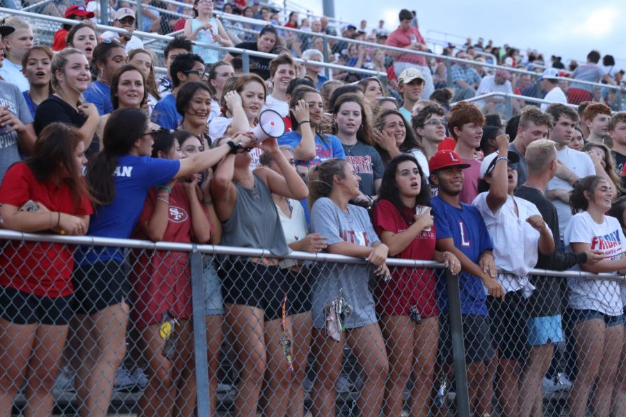 In the Bible stadium, the student section helps hype up the varsity football team during the scrimmage on Aug. 23.