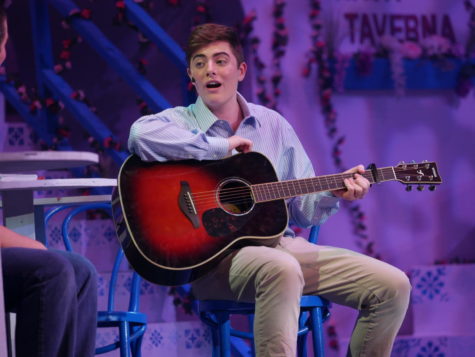 Senior Carver Ulrich as Harry Bright in Mamma Mia! playing guitar during his song Thank You for the Music