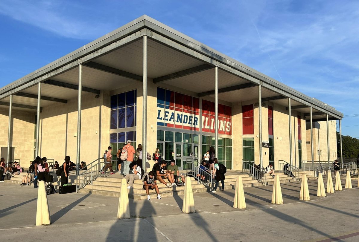 Students wait in front of the school at 7:40 a.m. during the first week of school, a three-day week. The school opened at 7:45 a.m. with zero-hour classes starting at 7:25 a.m. Photo by Lauren Batts