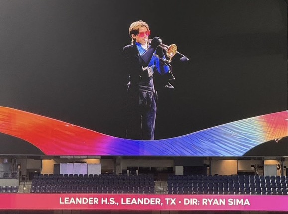 Aiden Spicer plays trumpet in his final performance of the band program’s ‘Shades’ at the grand national competition. “[This marching season] has definitely been my favorite out of the four that I’ve had,” Spicer said. “Overall, the vibe and culture of the band has been at an all-time high. Everyone has been so welcoming and has worked extra hard. It’s created a good end to the season.”