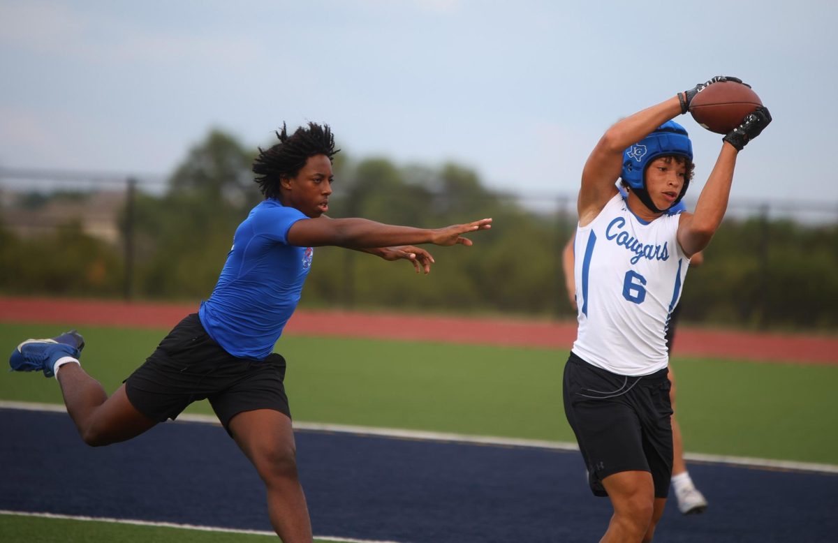 Junior Emmanuel Ugo reaches for a Lampasas player on April 29.