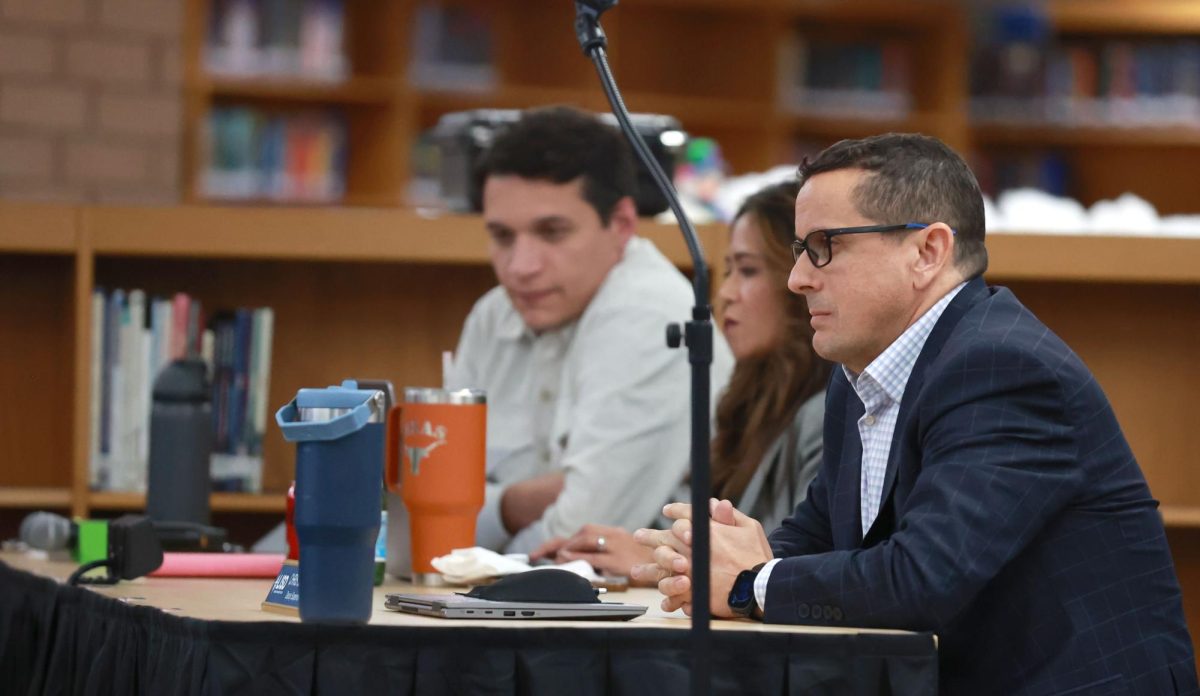 Deputy Superintendent of Learning & Innovation Chris Clark at the school board meeting Dec. 11 at Cedar Park Middle School. Photo by Griffin Darby