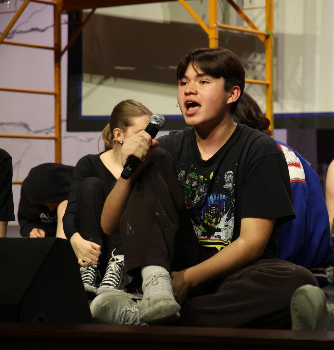 Freshman Brayden Rodriguez sings "Make 'Em Laugh" as his character Cosmo Brown for Singing In The Rain during the mic check at their rehearsal in the Performing Arts Center on Jan. 28.