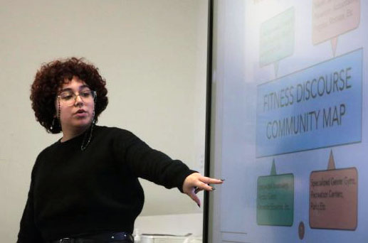 English teacher Paola Contreras explains an assignment to her class. Contreras' students crafted name tents, complete with their interests and hobbies to better connect the student to the person.