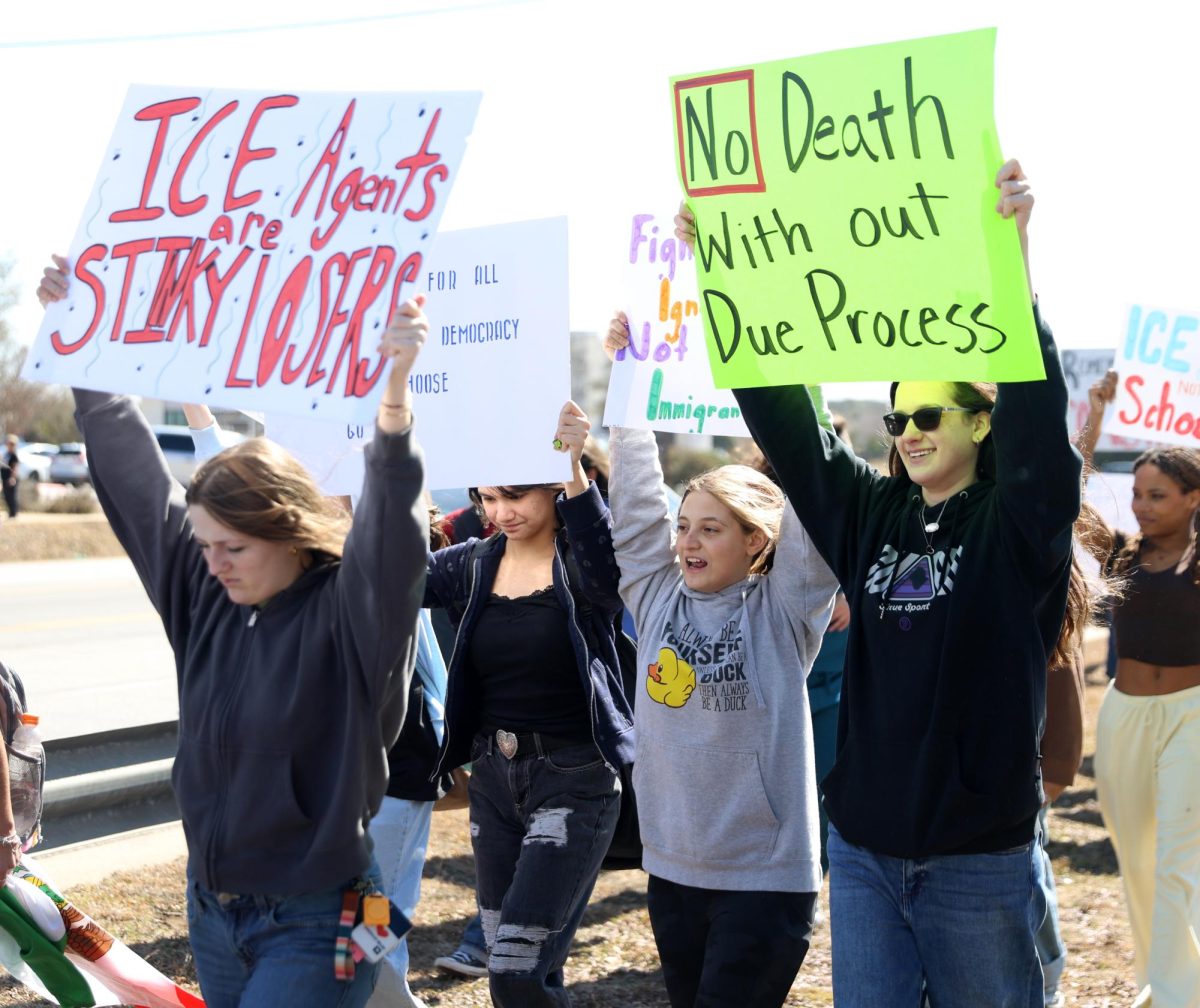 Students walk out against ICE on Feb. 4 at the front of the school. The students walked from the front of the school to Bledsoe Park. 