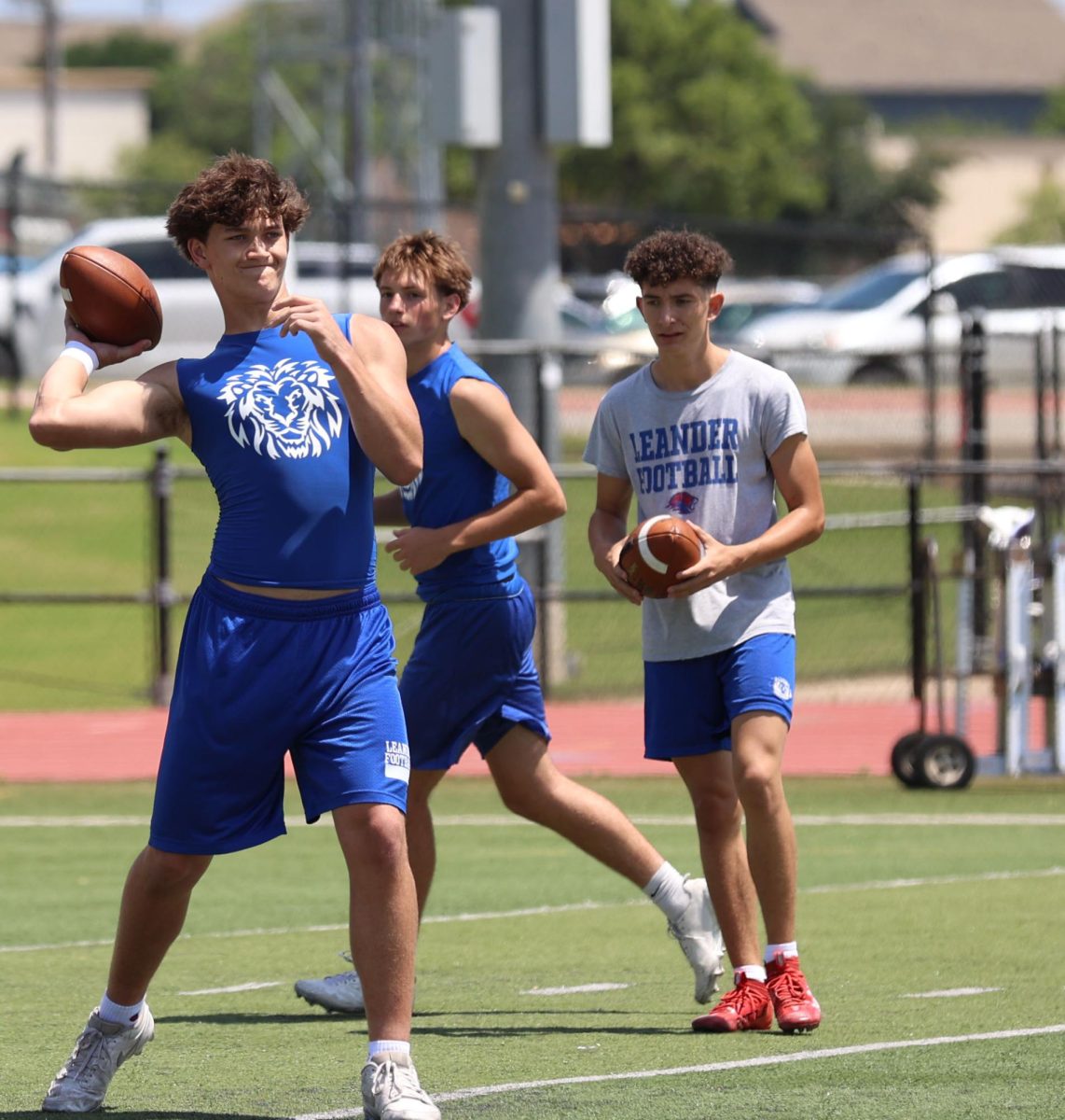 Sophomore Carson Cole practices his throws during 7 on 7 practice on May. 12, to train for his upcoming game against Cedar Park on May. 19. Photo by Griffin Darby