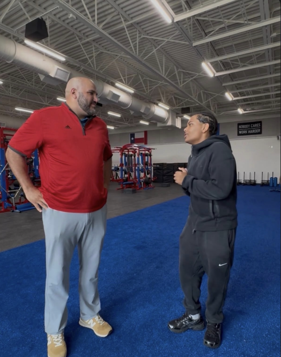 Head Coach Ahmad Zaiden getting interviewed about new Head Coach position in the new weightroom at Leander High School 