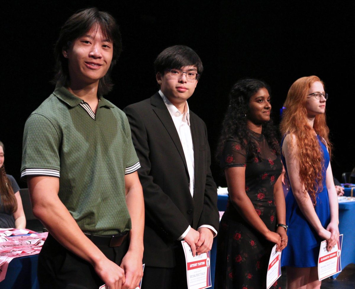 Seniors Darek Zhang, Anthony Tamtoro, Agnes Gijo and Elizabeth Chaison at senior awards ceremony in the performing arts center May 20.