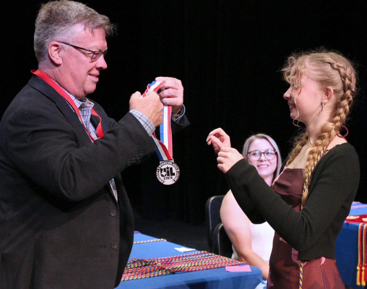 Senior Sophia Clapp receives second-place University Interscholastic League academics state feature-writing medal at senior awards ceremony in the performing arts center May 20. She won the award at the 2026 UIL academic state meet May 18.