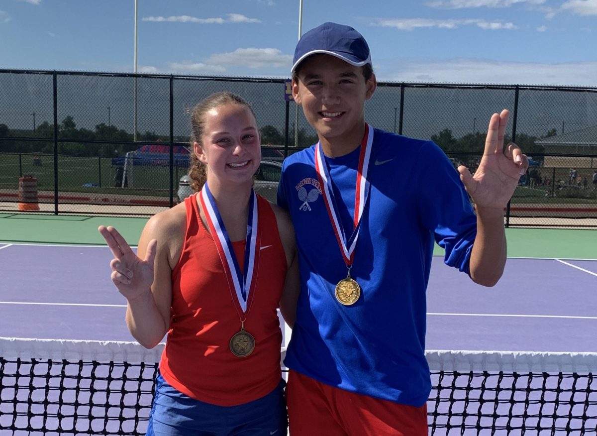 Junior Emma Davis and sophomore Andrew Waterman posing with their medals after winning at the tennis district competition at Liberty Hill High School April 8. 